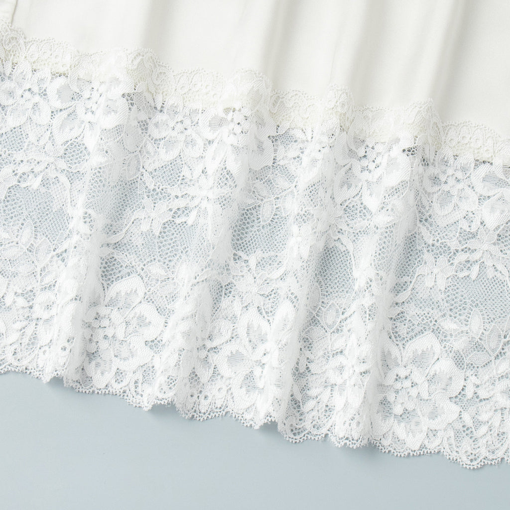 Satin Midi Skirt with Lace Hem in Ivory — close-up of floral lace hem