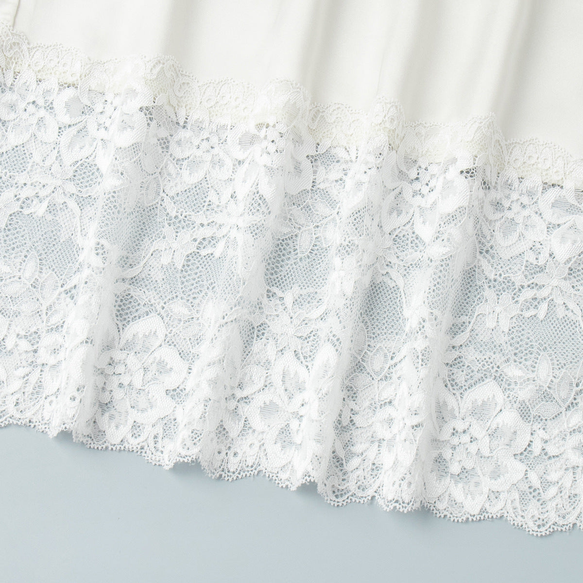 Satin Midi Skirt with Lace Hem in Ivory — close-up of floral lace hem