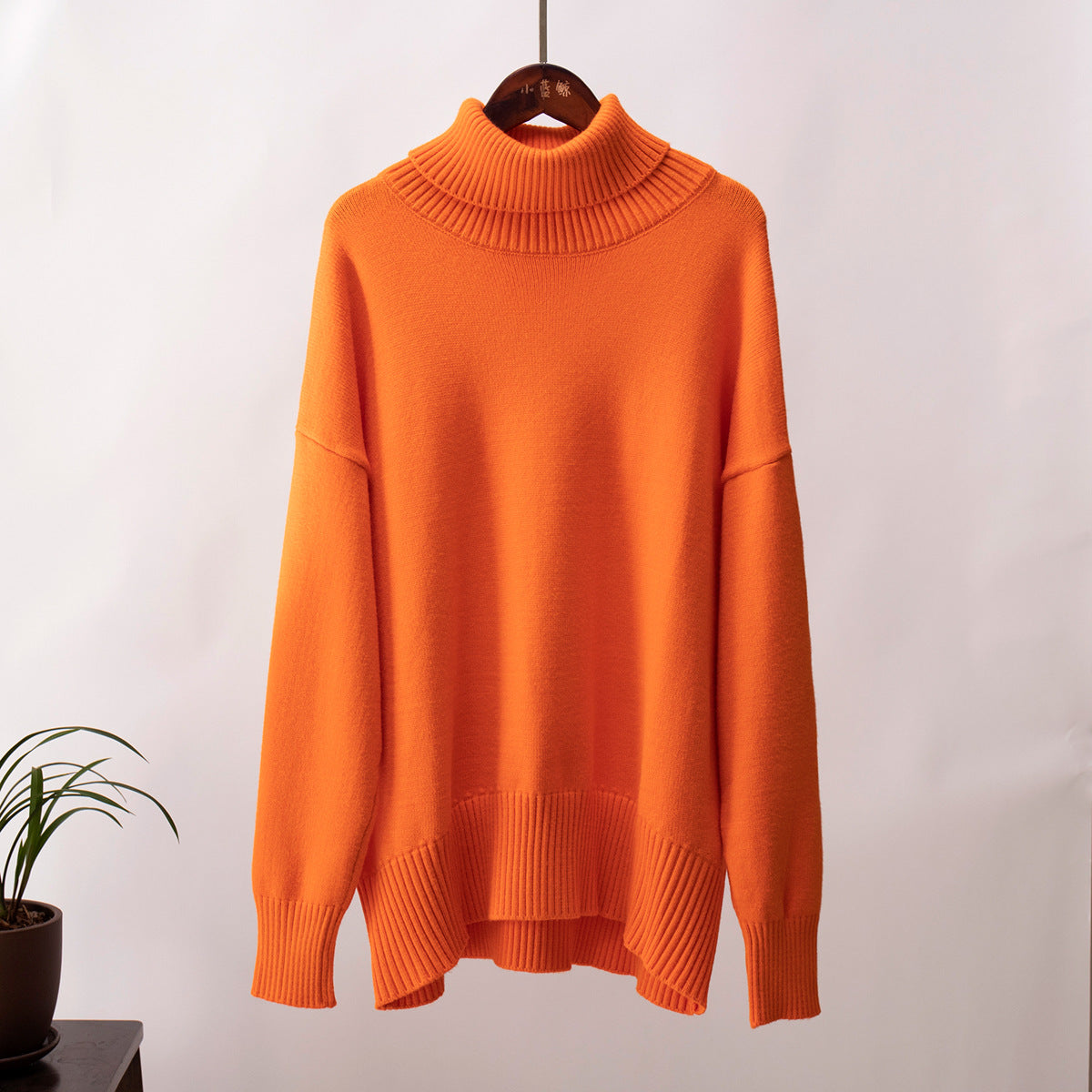 Oversized Knit Turtleneck Sweater in Orange — front view