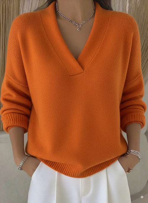 Relaxed V-Neck Knit Sweater in Orange — front view on model