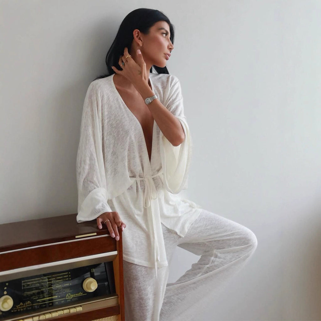 Wrap Tie Top & Wide-Leg Lounge Pants Set in White — on model, seated