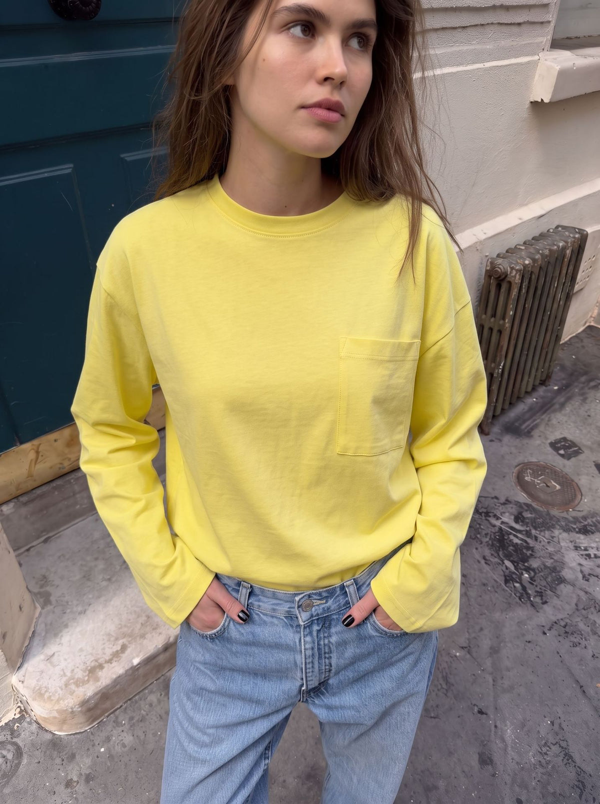 Relaxed Cotton Long-Sleeve Pocket Tee in Butter Yellow — on model with jeans