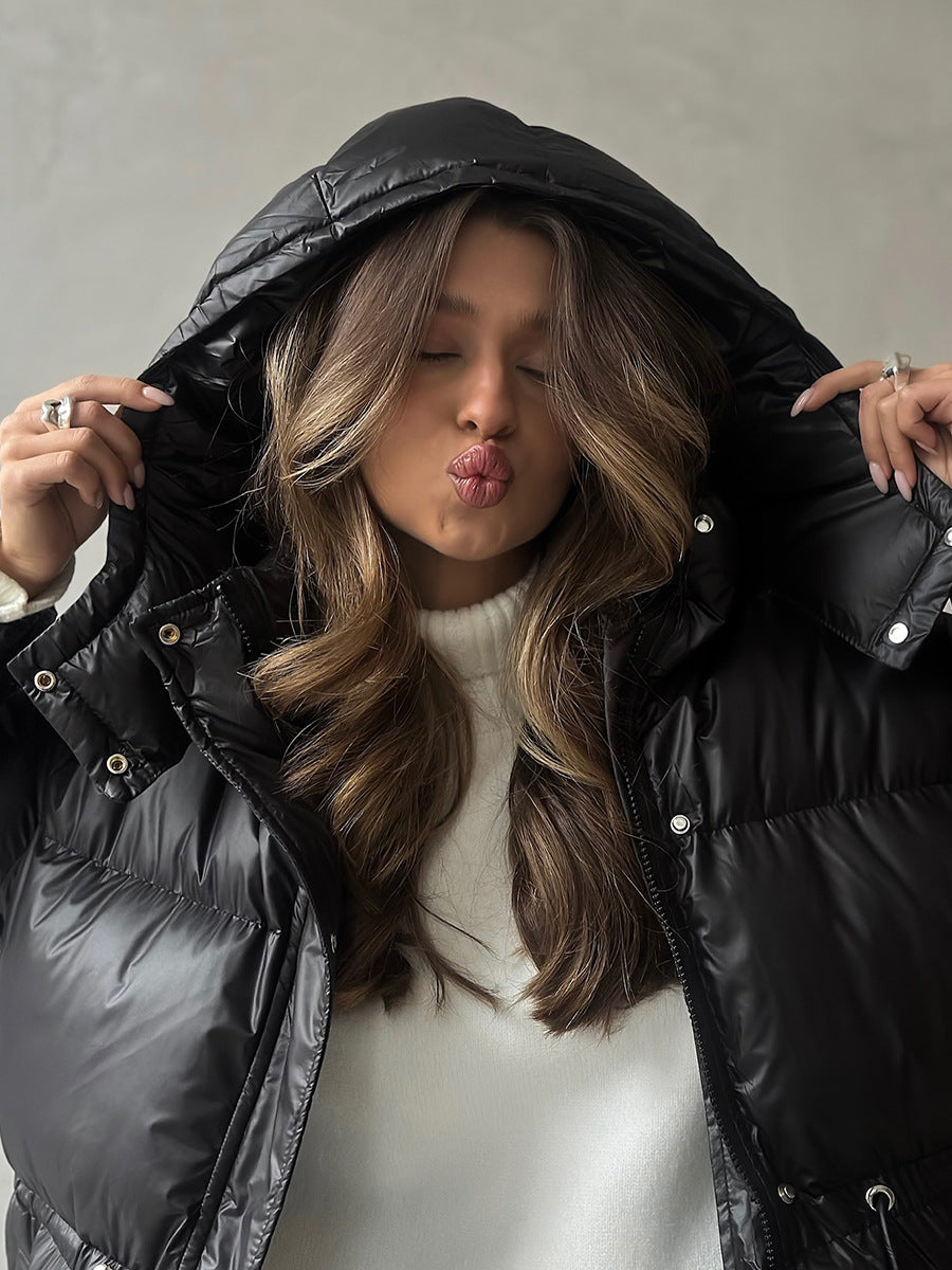 Hooded Puffer Jacket with Drawstring Waist in Black — close-up with the hood up