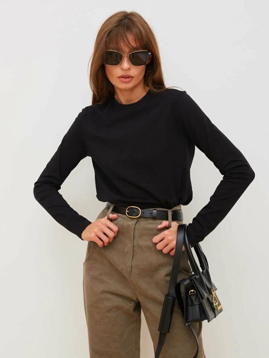 Everyday Cotton Crew Neck Long Sleeve Tee in Black — tucked into trousers