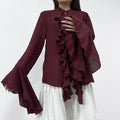Cascading Ruffle Blouse with Bell Sleeves in Burgundy — front view on model