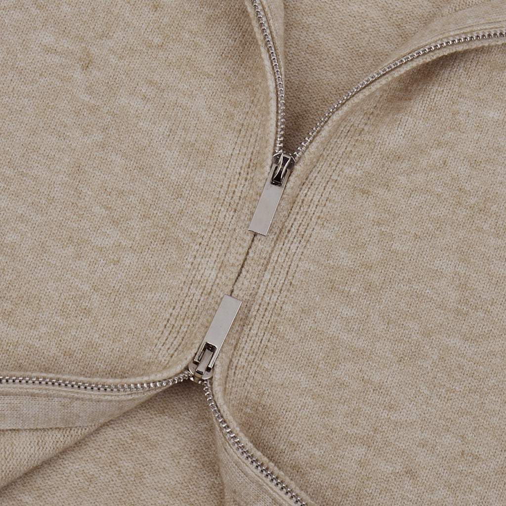 Three-Piece Knit Set: Zip-Up Cardigan, Sleeveless Top & Wide-Leg Pants in Oat — close-up of the two-way zipper