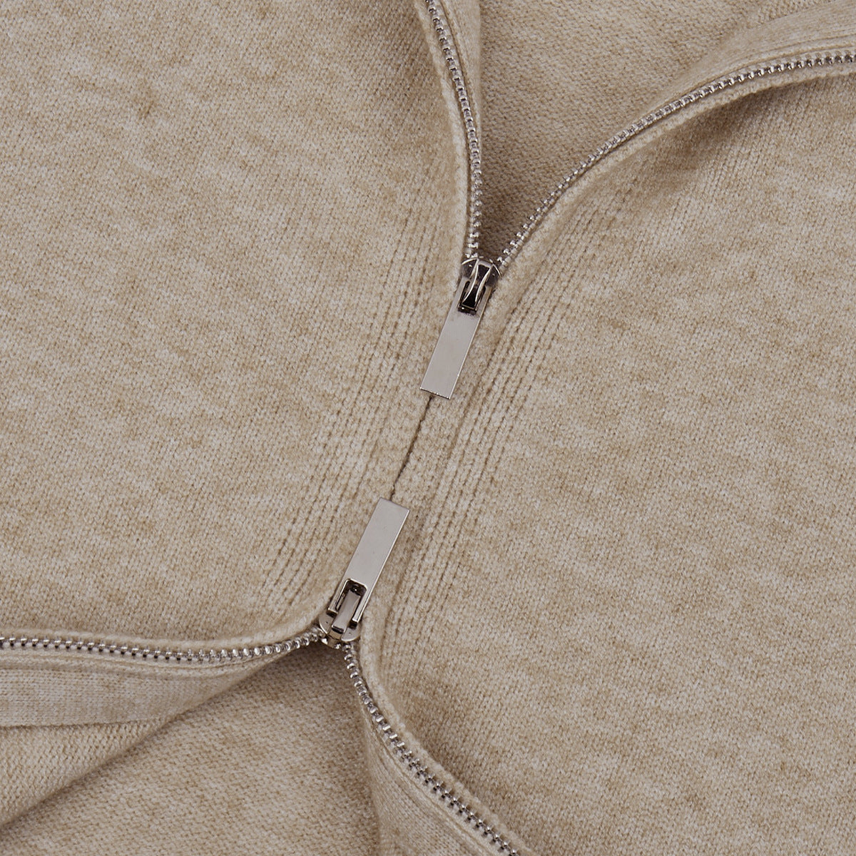 Three-Piece Knit Set: Zip-Up Cardigan, Sleeveless Top & Wide-Leg Pants in Oat — close-up of the two-way zipper