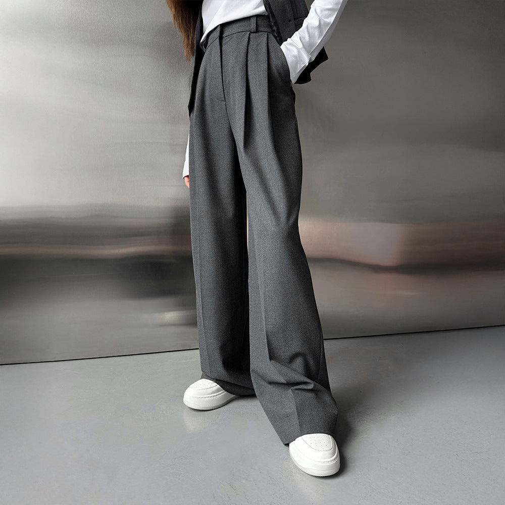 Pleated Wide-Leg Trousers in Charcoal Gray — on model, front view
