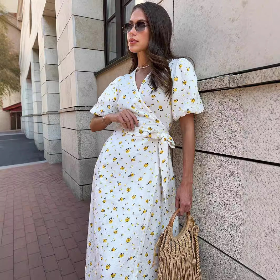 Cotton Floral Puff-Sleeve Wrap Midi Dress in Yellow Floral — walking view on model