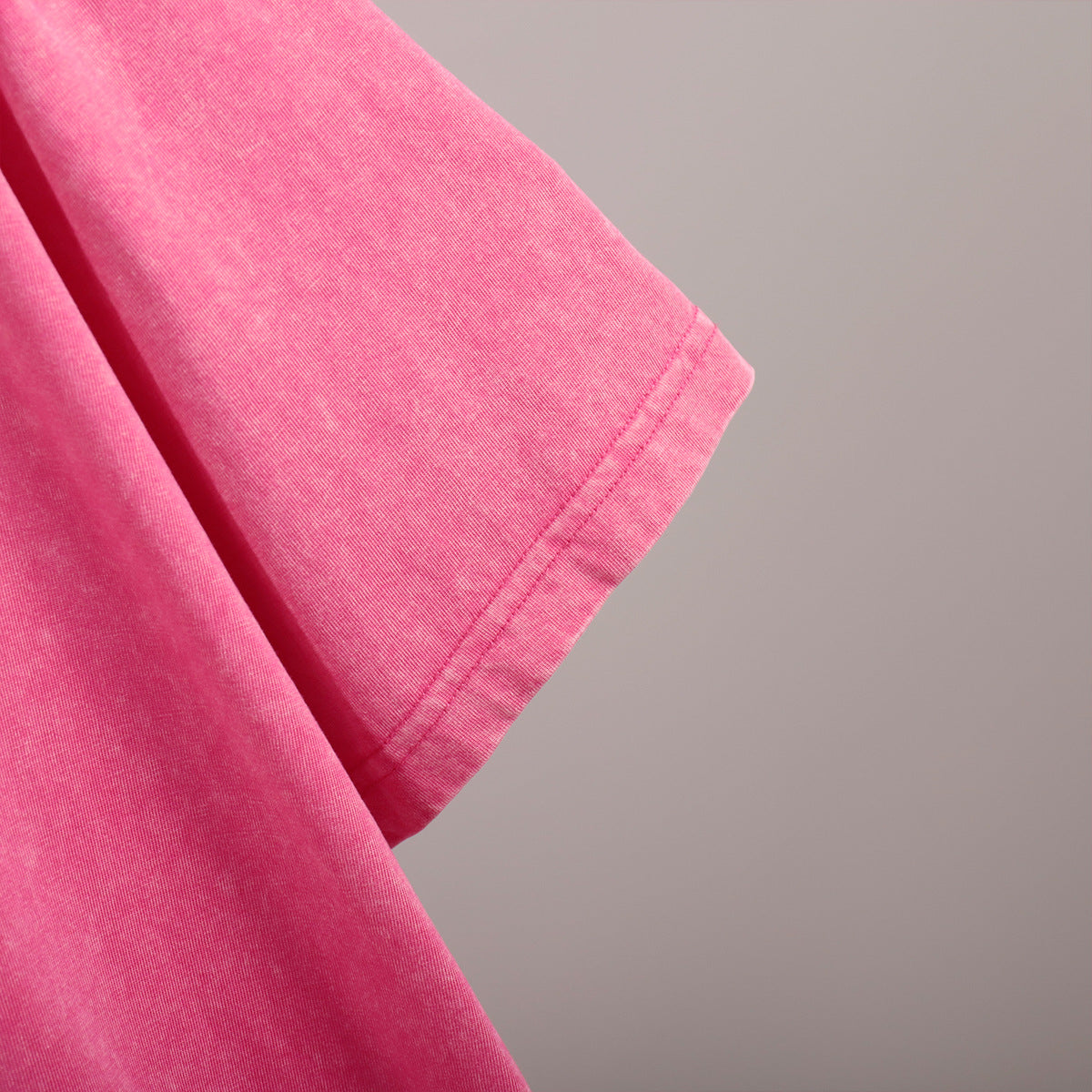 Oversized Washed Cotton Crewneck Tee in Hot Pink — close-up of the hem