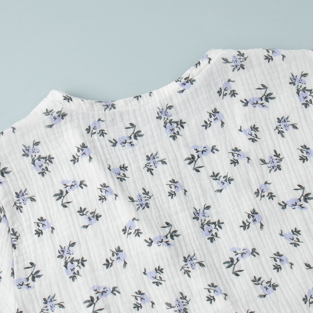 Cotton Puff-Sleeve Wrap Midi Dress in Blue Floral — close-up of the wrap tie