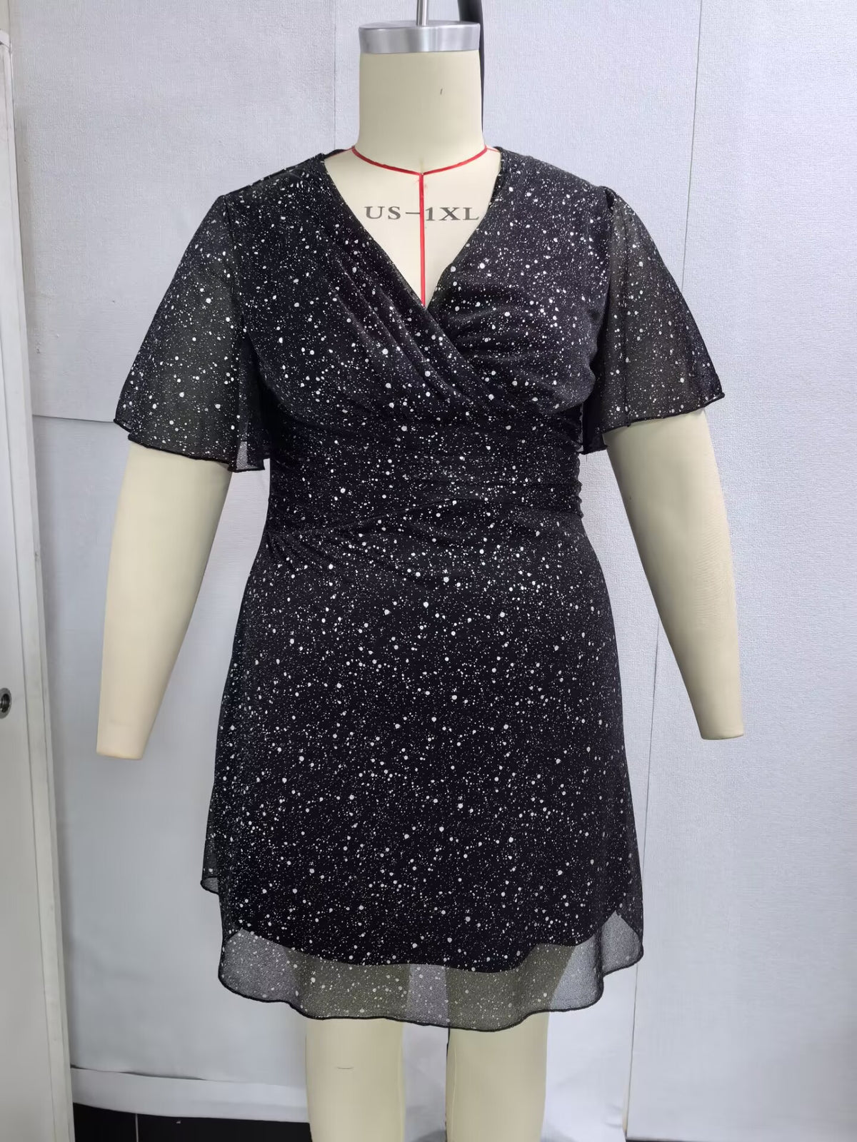 Plus-Size Glitter Wrap-Front Party Dress with Flutter Sleeves in Black — front view on mannequin
