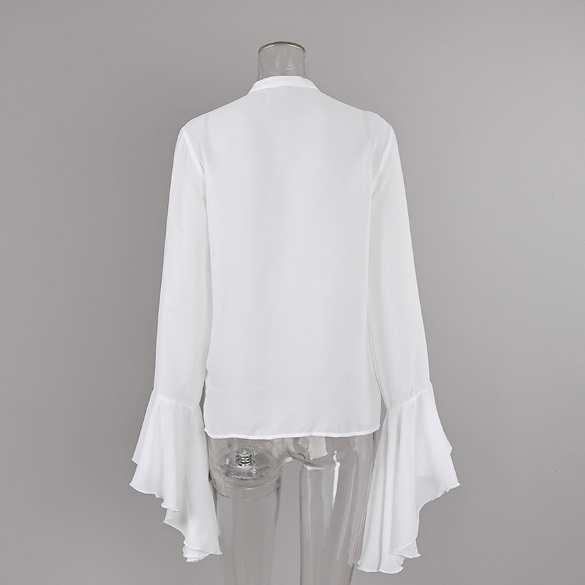 Cascading Ruffle Blouse with Bell Sleeves in White — back view on mannequin