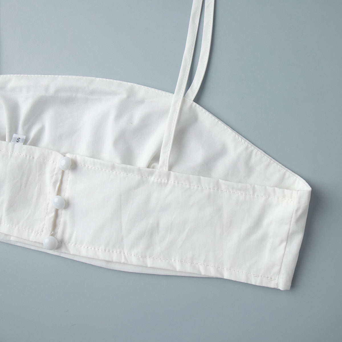 Cotton Crop Camisole & Gathered Maxi Skirt Set in White — close-up of the top side buttons