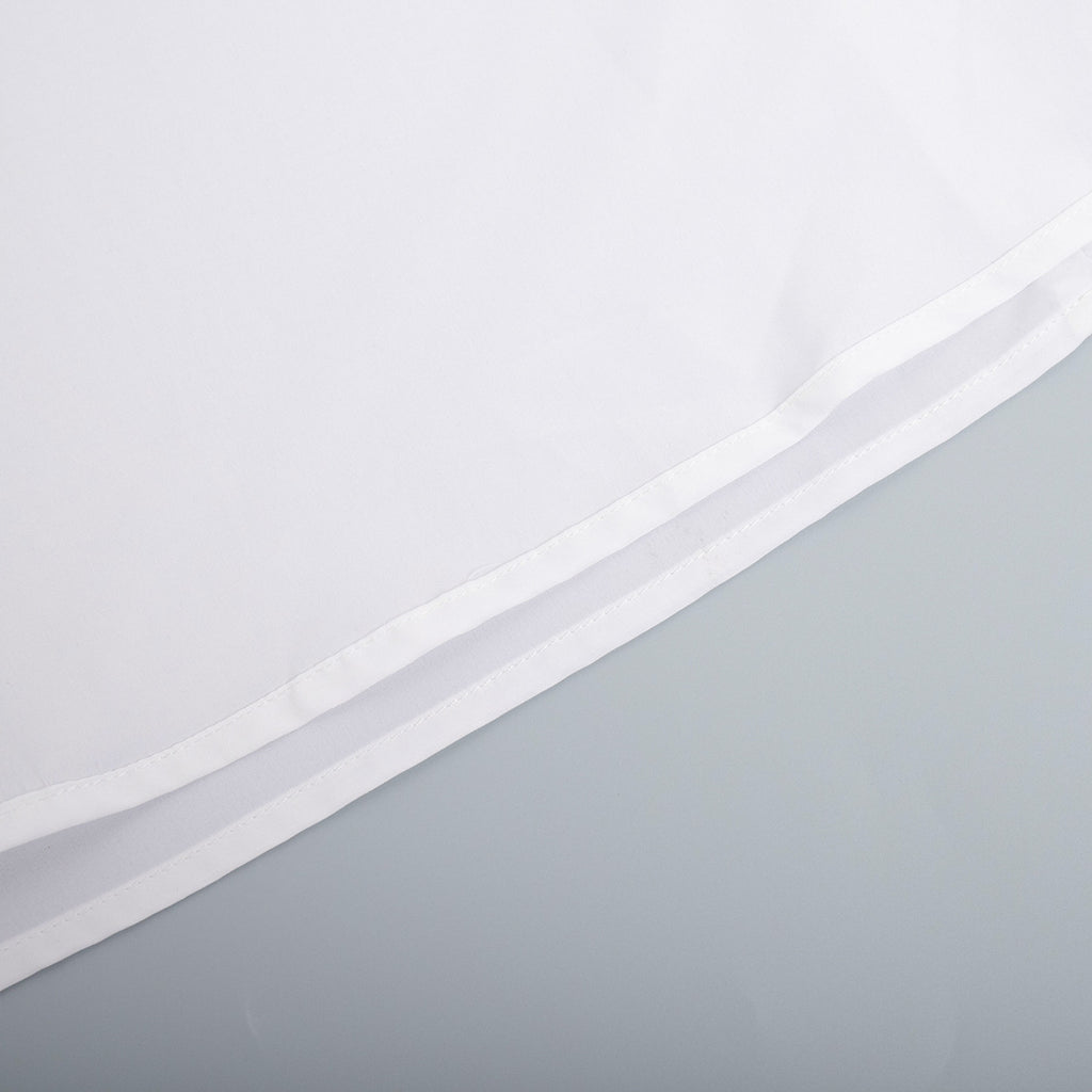 Cotton Halter V-Neck Maxi Dress in White — close-up of the hem