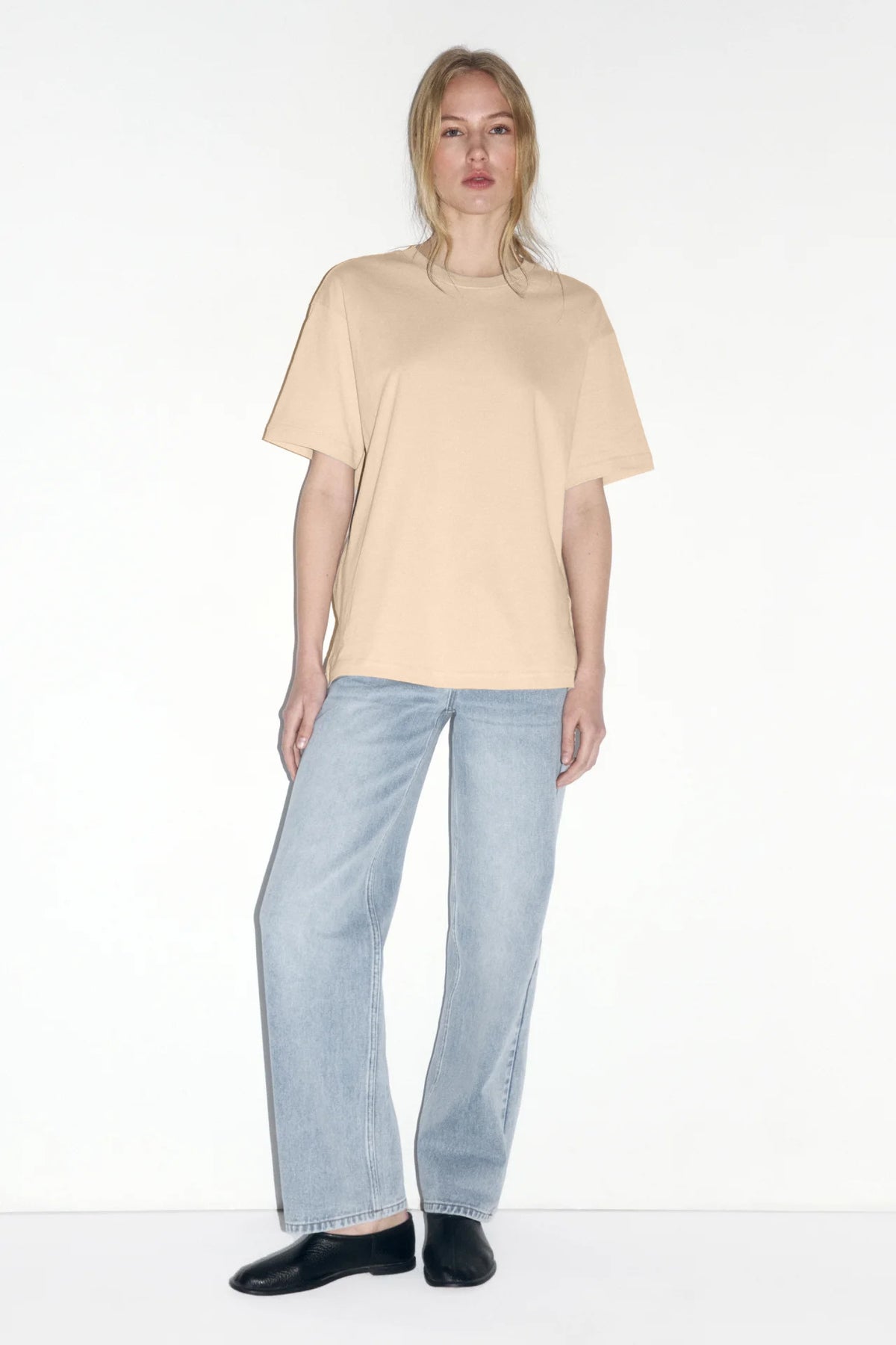 Relaxed Cotton Crew-Neck Tee in Beige — full-length view on model with jeans