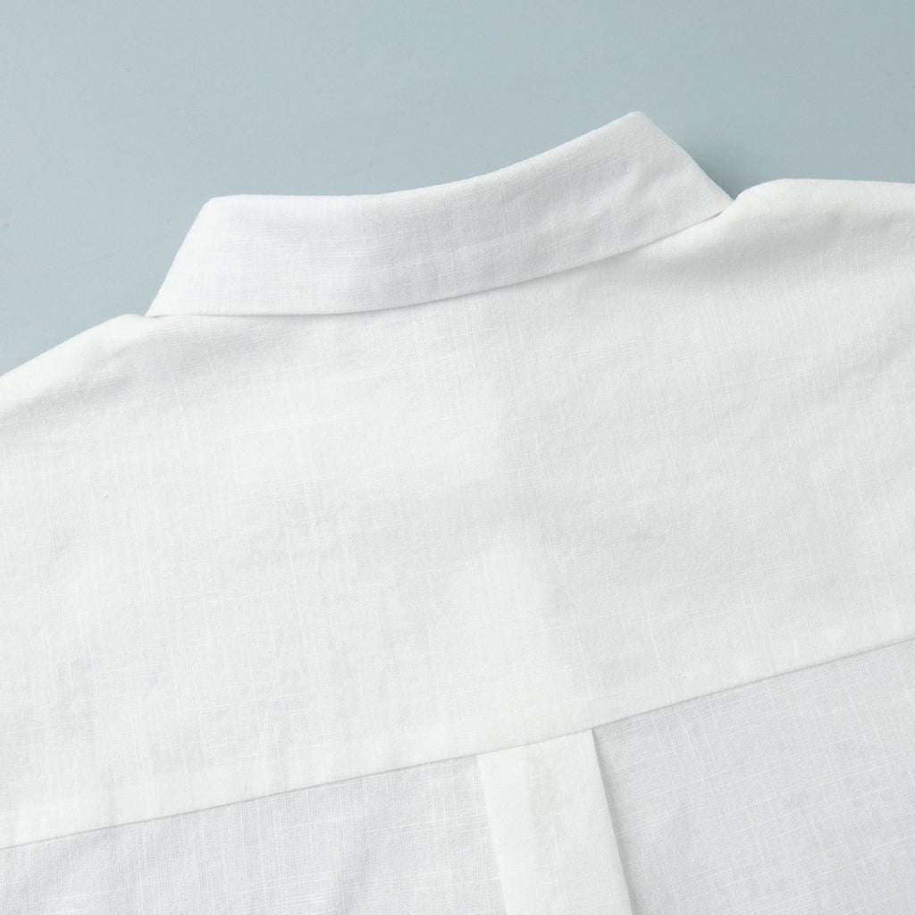 Tie-Front Cotton Mini Shirt Dress in White — close-up of the pointed collar