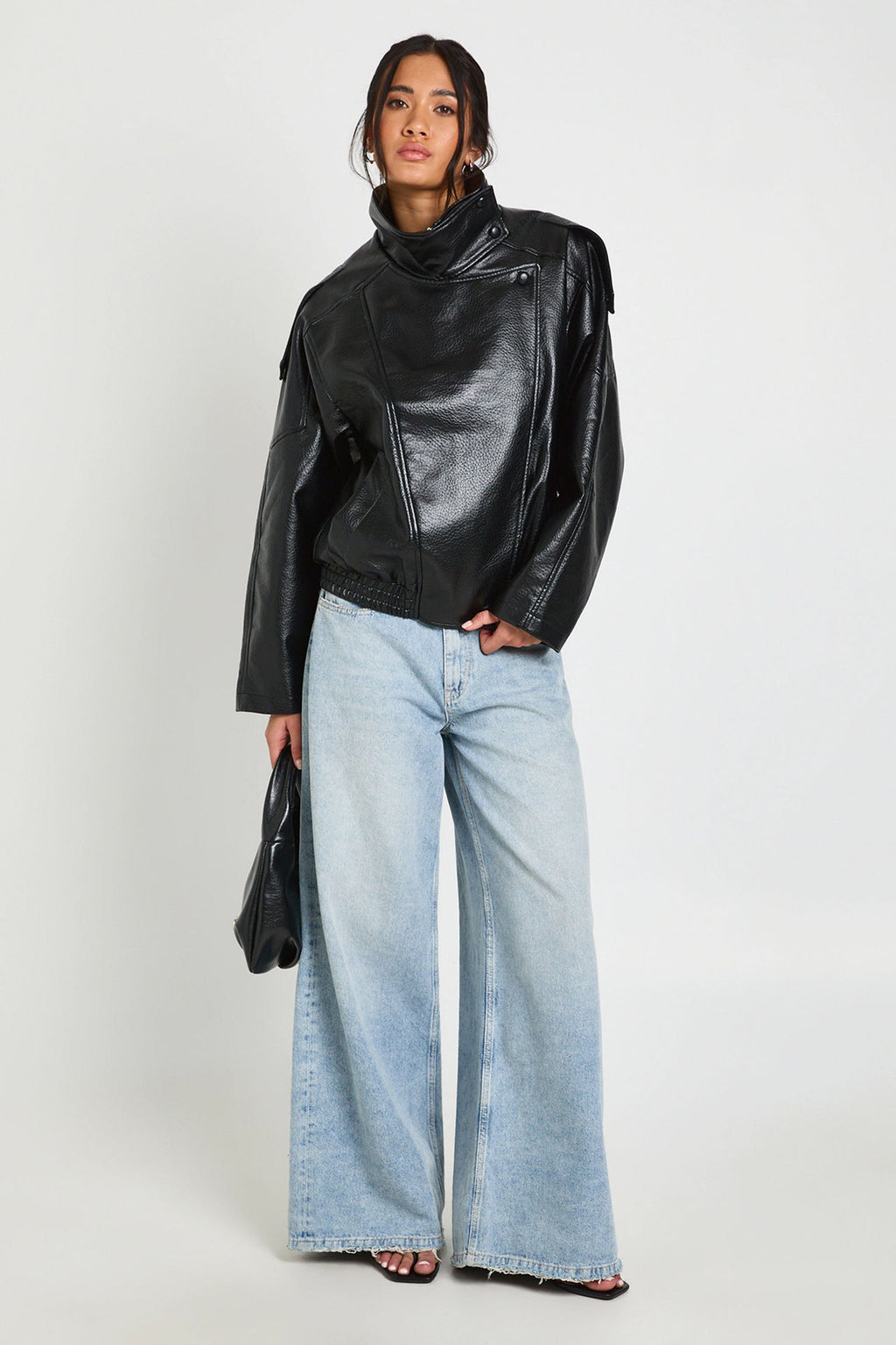 Oversized Stand-Collar Faux Leather Jacket in Black — full-length view on model