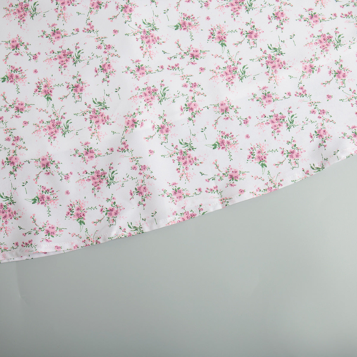 Floral Puff-Sleeve V-Neck Maxi Dress in White Floral — close-up of hem