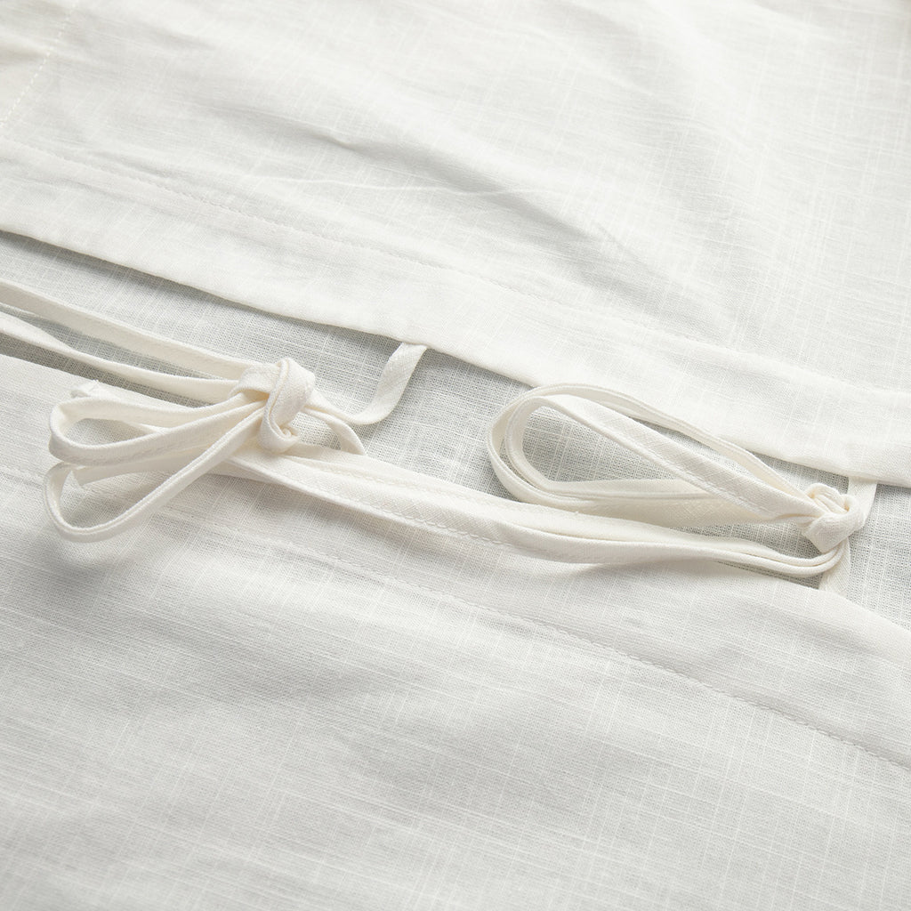 Cotton Tie-Front Top & Ruffle Shorts Set in White — close-up of the front ties