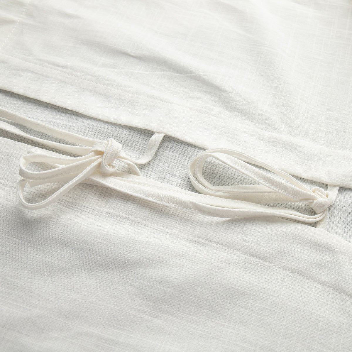 Cotton Tie-Front Top & Ruffle Shorts Set in White — close-up of the front ties