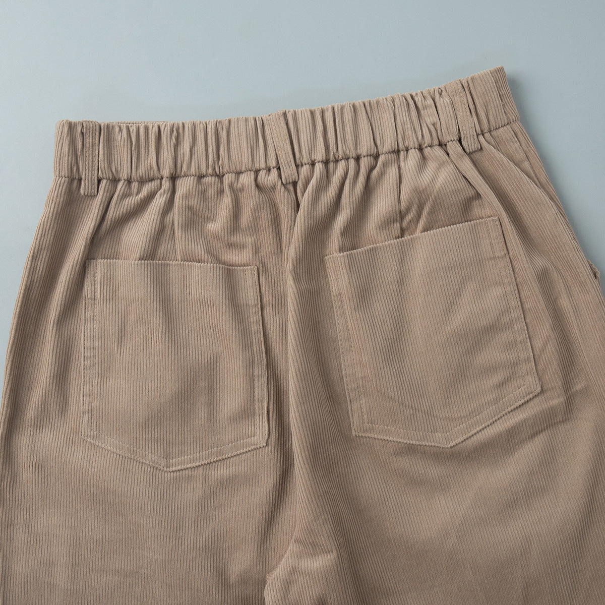 Cotton Corduroy Wide-Leg Pants with Pintuck Front in Light Khaki — close-up of the elastic back waistband and patch pockets