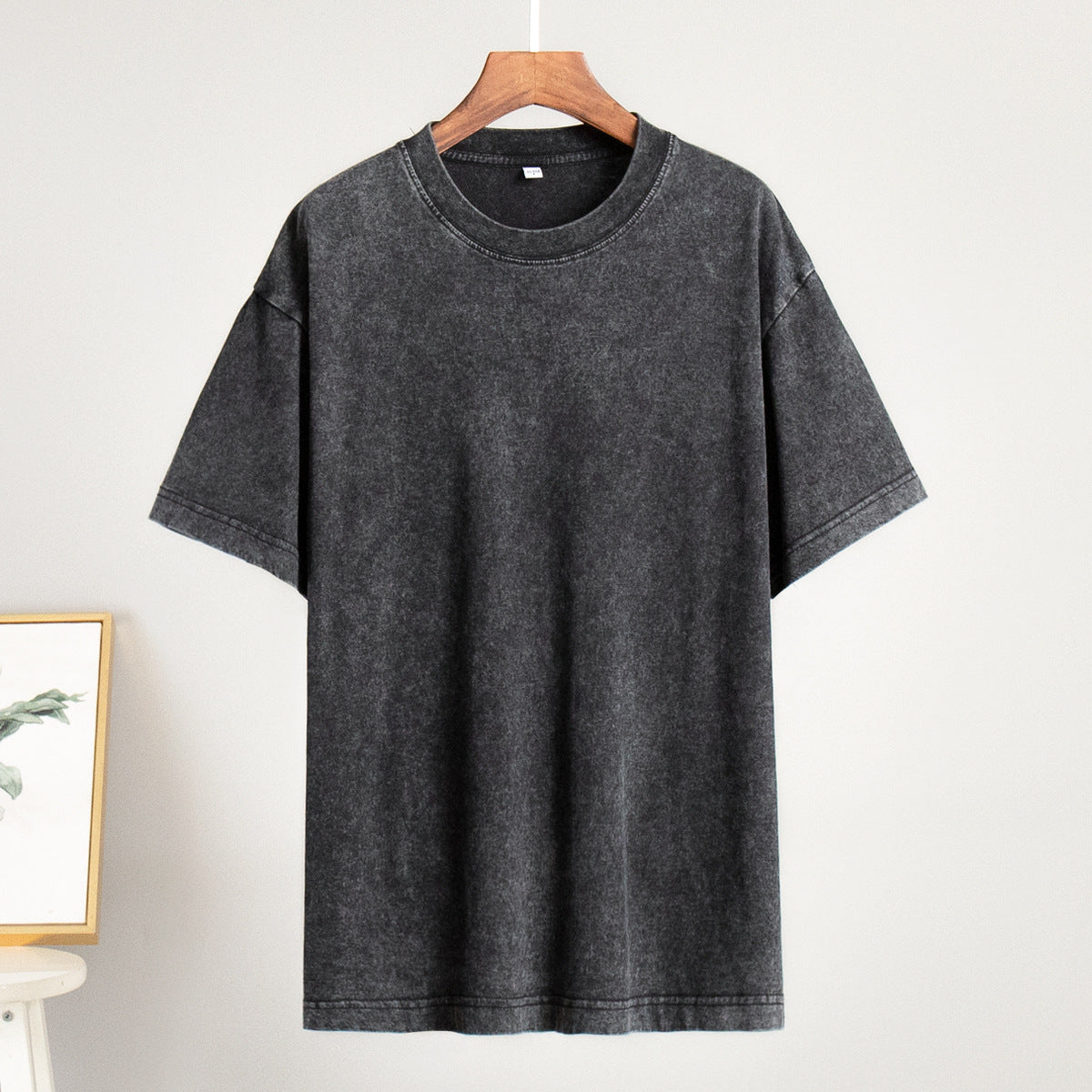 Oversized Washed Cotton Crewneck Tee in Washed Black — on hanger