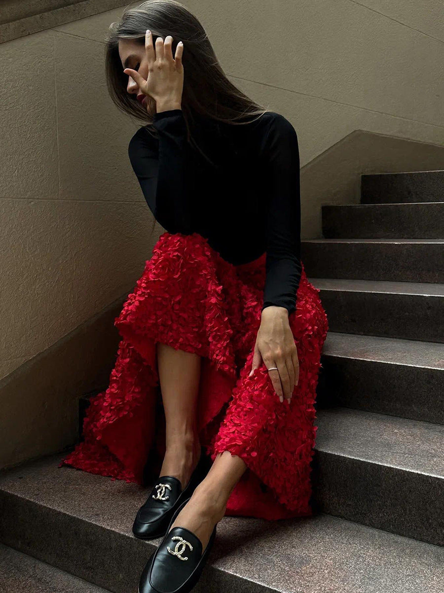 3D Rose Petal A-Line Maxi Skirt in Red — worn with a black top on the stairs