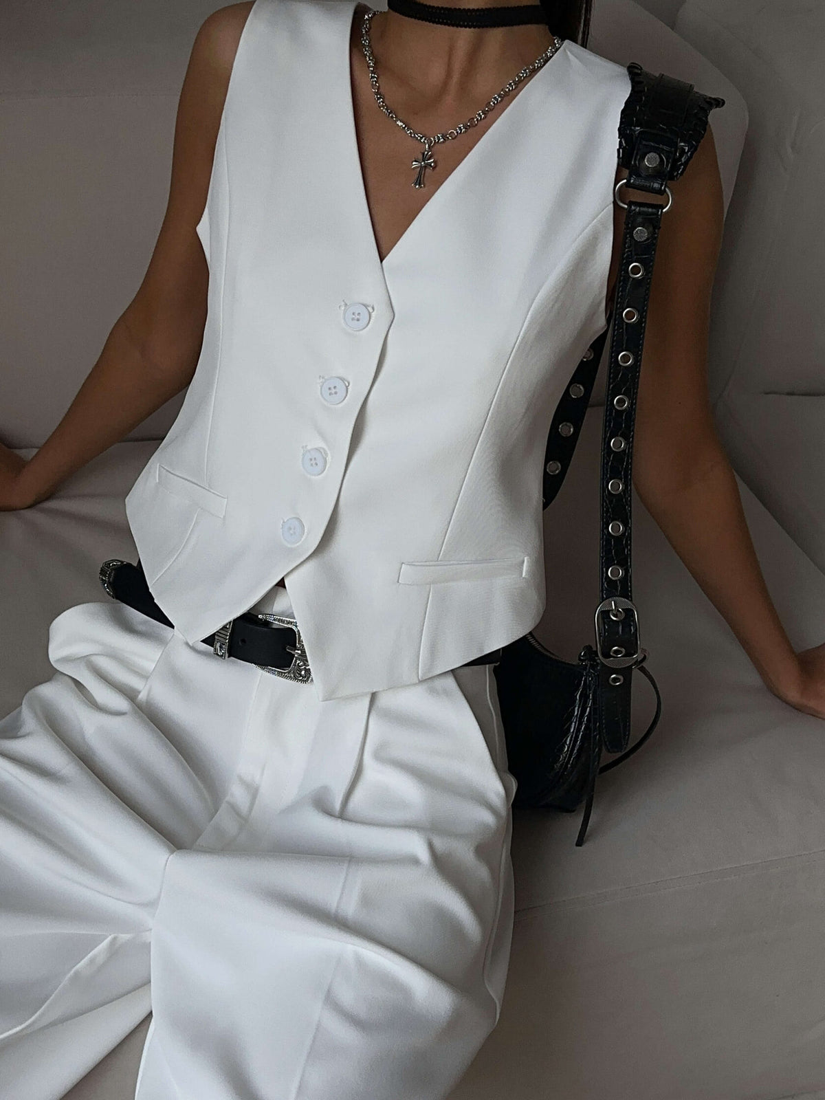 V-Neck Vest & Pleated Shorts Set in White — close-up of vest on model