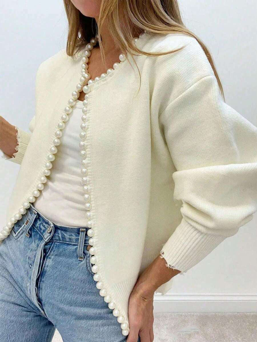 Pearl-Trim Frayed-Edge Knit Cardigan in Ivory — front view on model