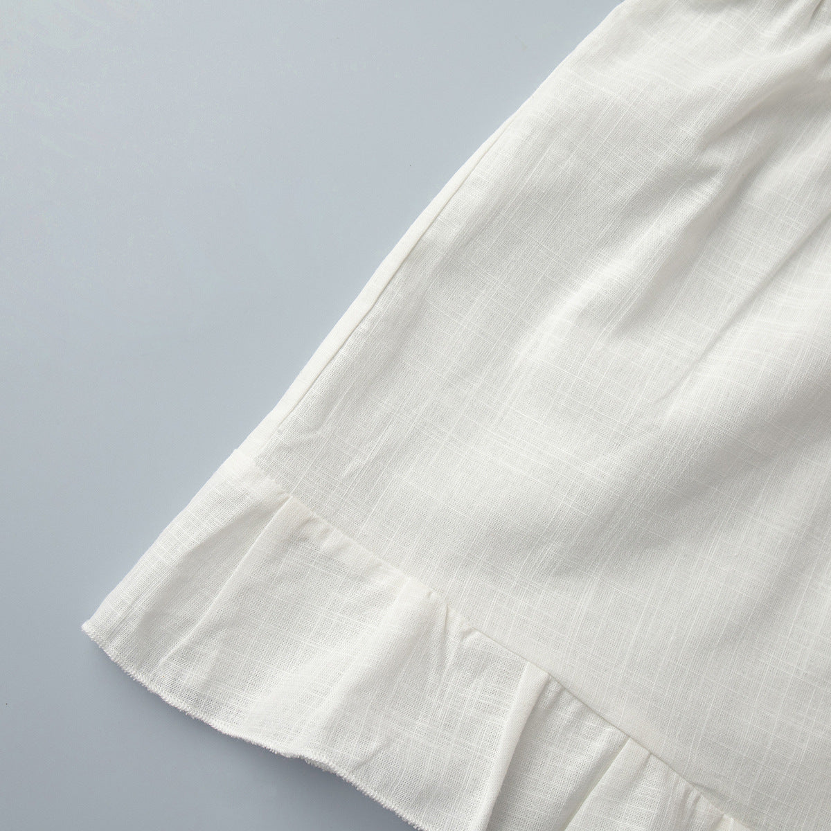 Cotton Tie-Front Top & Ruffle Shorts Set in White — close-up of the ruffle hem