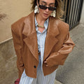 Faux Leather Blazer Jacket with Padded Shoulders in Cognac — front view on model