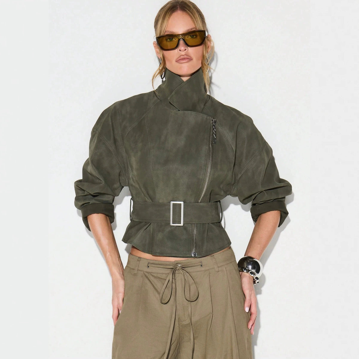 Belted Faux Suede Moto Jacket with Asymmetric Zip in Olive — front view on model, zipped and belted