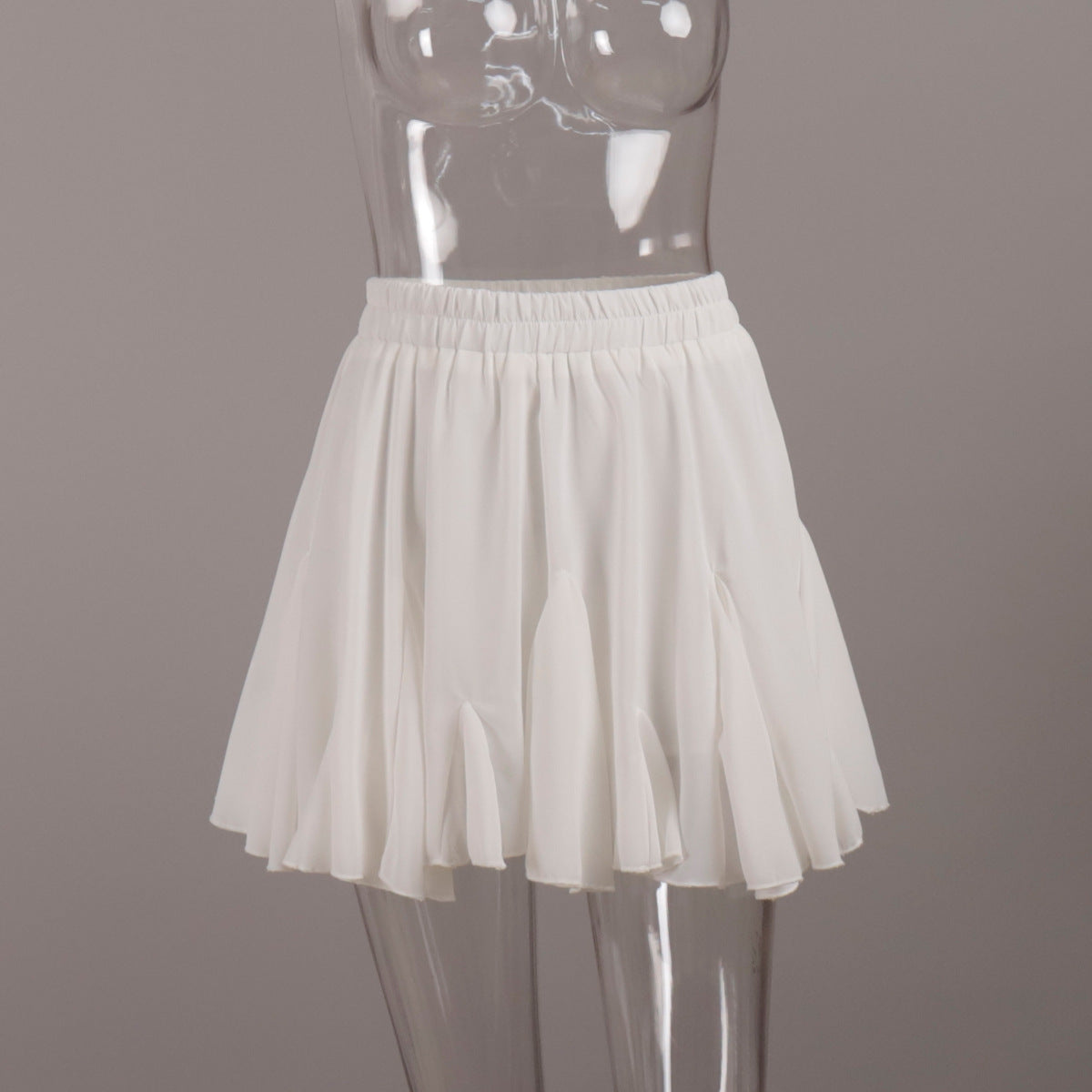 Pleated Bubble Mini Skirt in White — front view on mannequin