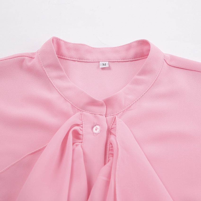 Cascading Ruffle Blouse with Bell Sleeves in Pink — close-up of the band collar