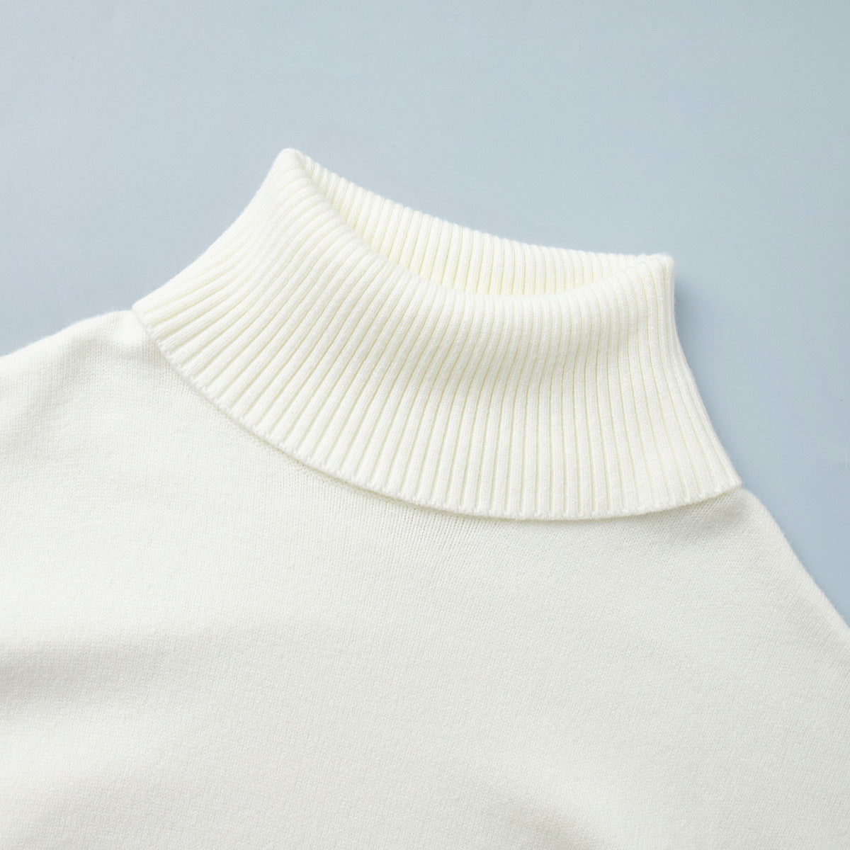 Oversized Turtleneck Sweater & Knit Maxi Skirt Set in Ivory — close-up of the turtleneck