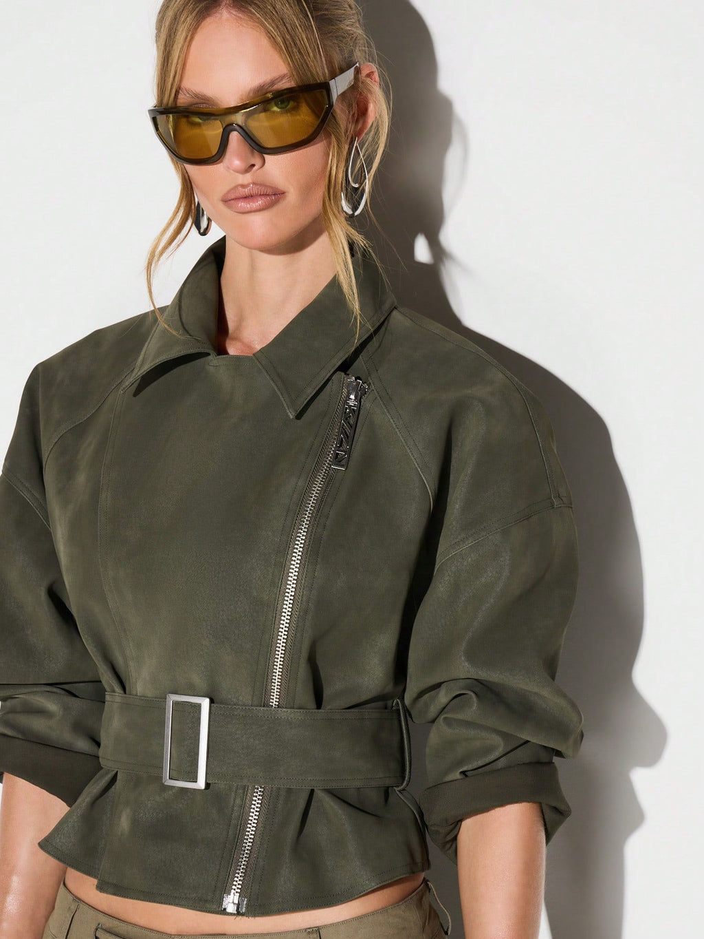 Belted Faux Suede Moto Jacket with Asymmetric Zip in Olive — on model with the lapel collar and belt
