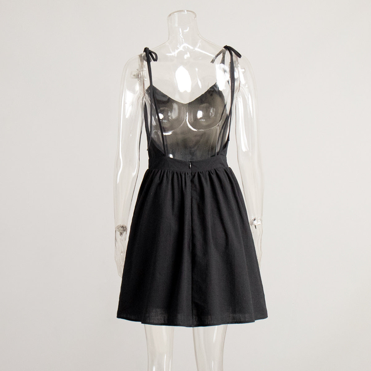 Tie-Shoulder Open-Back Cotton Mini Dress in Black — back view on mannequin