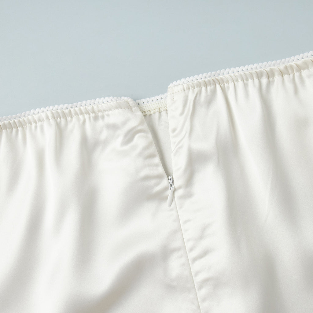Satin Midi Skirt with Lace Hem in Ivory — close-up of waistband lace edge