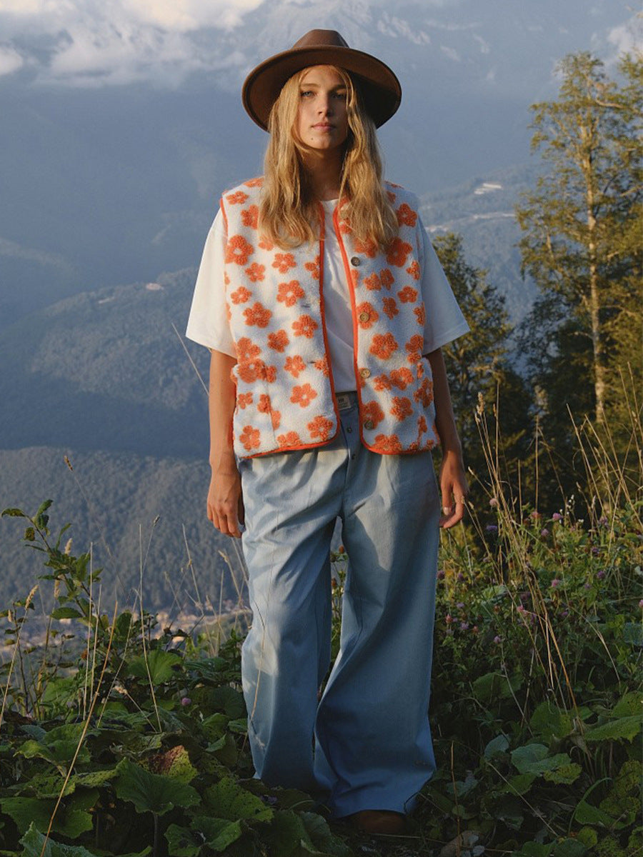 Floral Sherpa Fleece Button Vest with Pockets in Cream & Orange Floral — full-length view on model