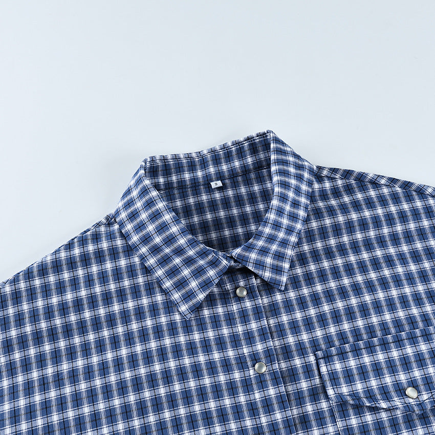 Oversized Cotton Plaid Button-Up Shirt in Navy Plaid — close-up of the collar