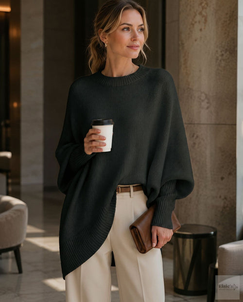 Oversized Batwing Crew-Neck Sweater in Black — front view on model