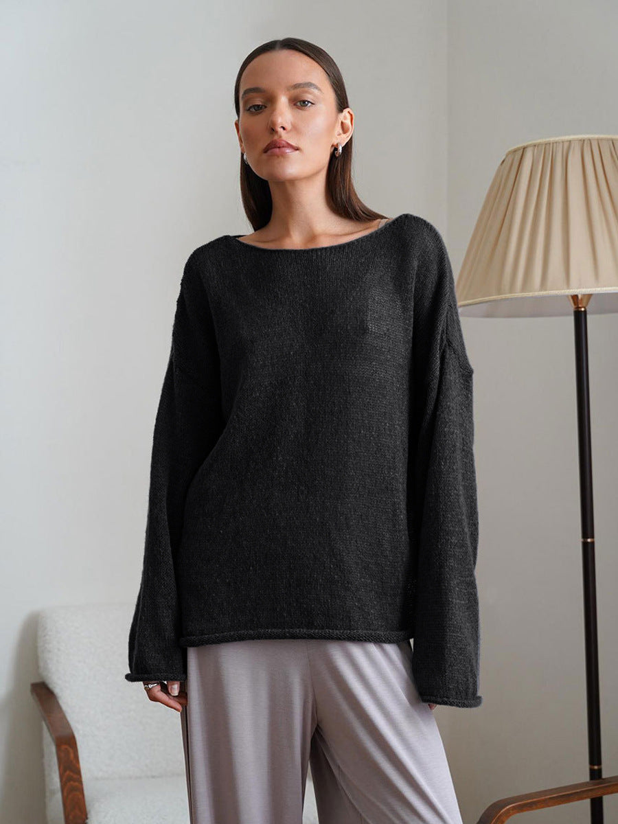 Sheer Open-Knit Bell Sleeve Sweater in Black — front view on model