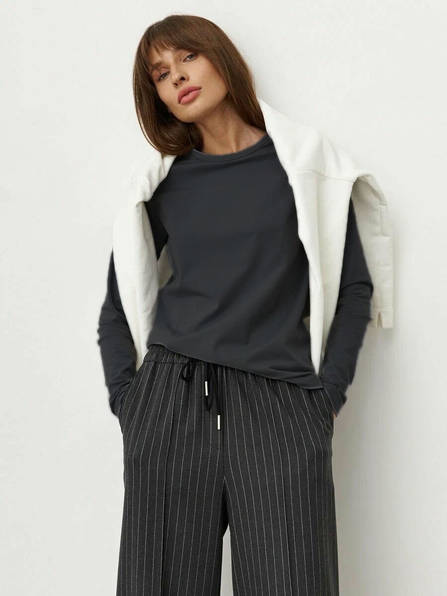 Everyday Cotton Crew Neck Long Sleeve Tee in Charcoal — front view on model, sweater over the shoulders