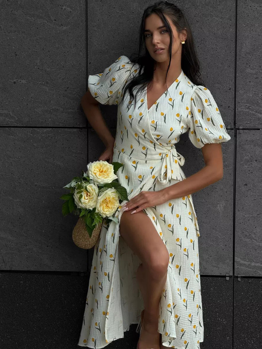 Cotton Puff-Sleeve Wrap Midi Dress in Yellow Floral — front view on model
