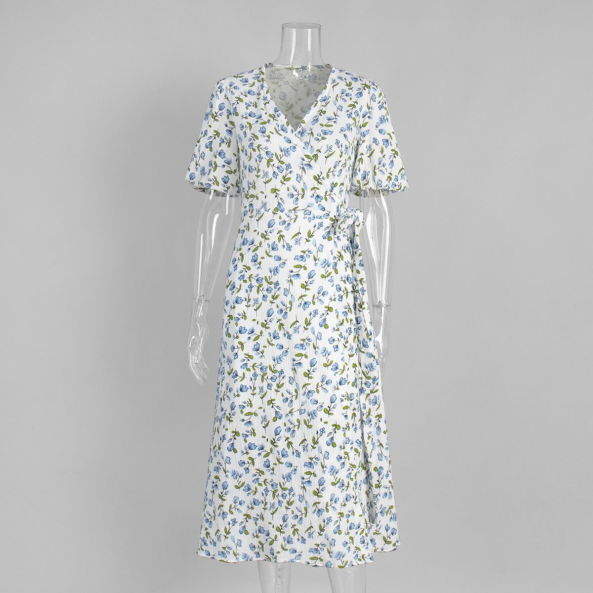 Cotton Puff-Sleeve Wrap Midi Dress in Blue Floral — front view on mannequin
