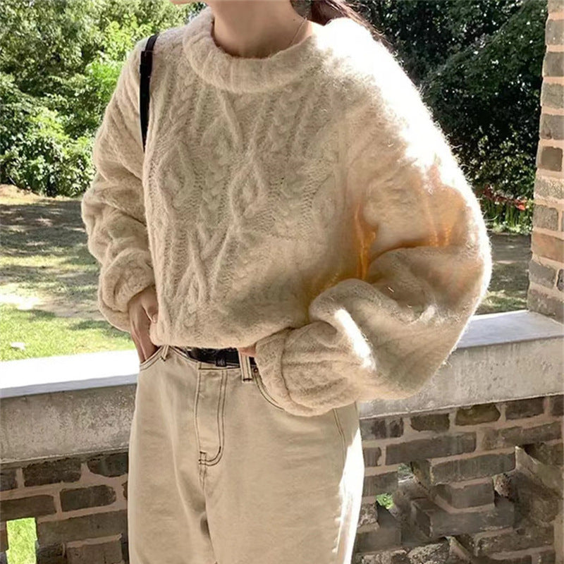 Chunky Cable-Knit Crew-Neck Sweater in Ivory — on model