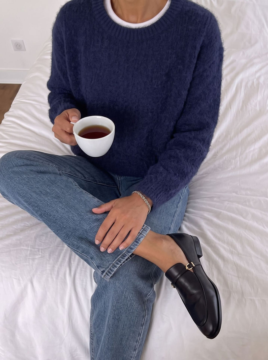 Brushed Fuzzy Knit Crew Neck Sweater in Navy — seated view on model