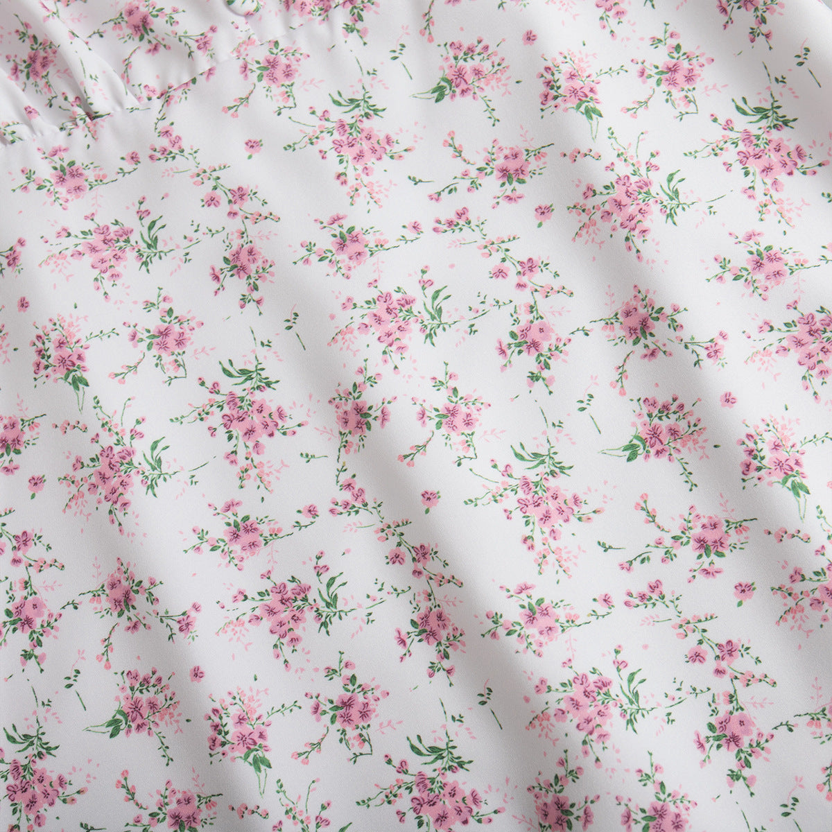 Floral Puff-Sleeve V-Neck Maxi Dress in White Floral — close-up of floral print