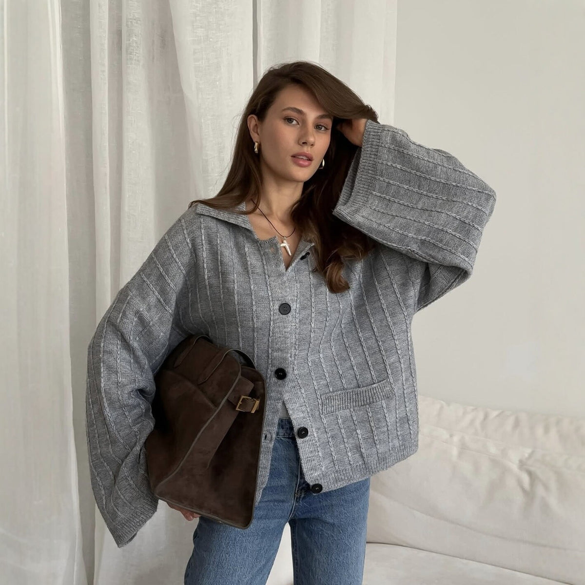 Oversized Collared Button Cardigan with Bell Sleeves in Heather Gray — on model, holding the collar